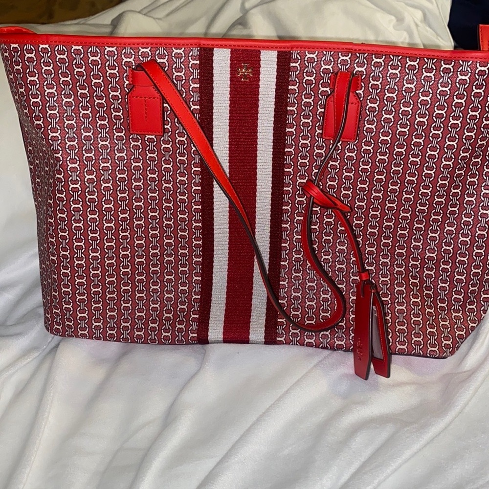 Tory Burch tote bag. It is red. Excellent condition. Zips up
